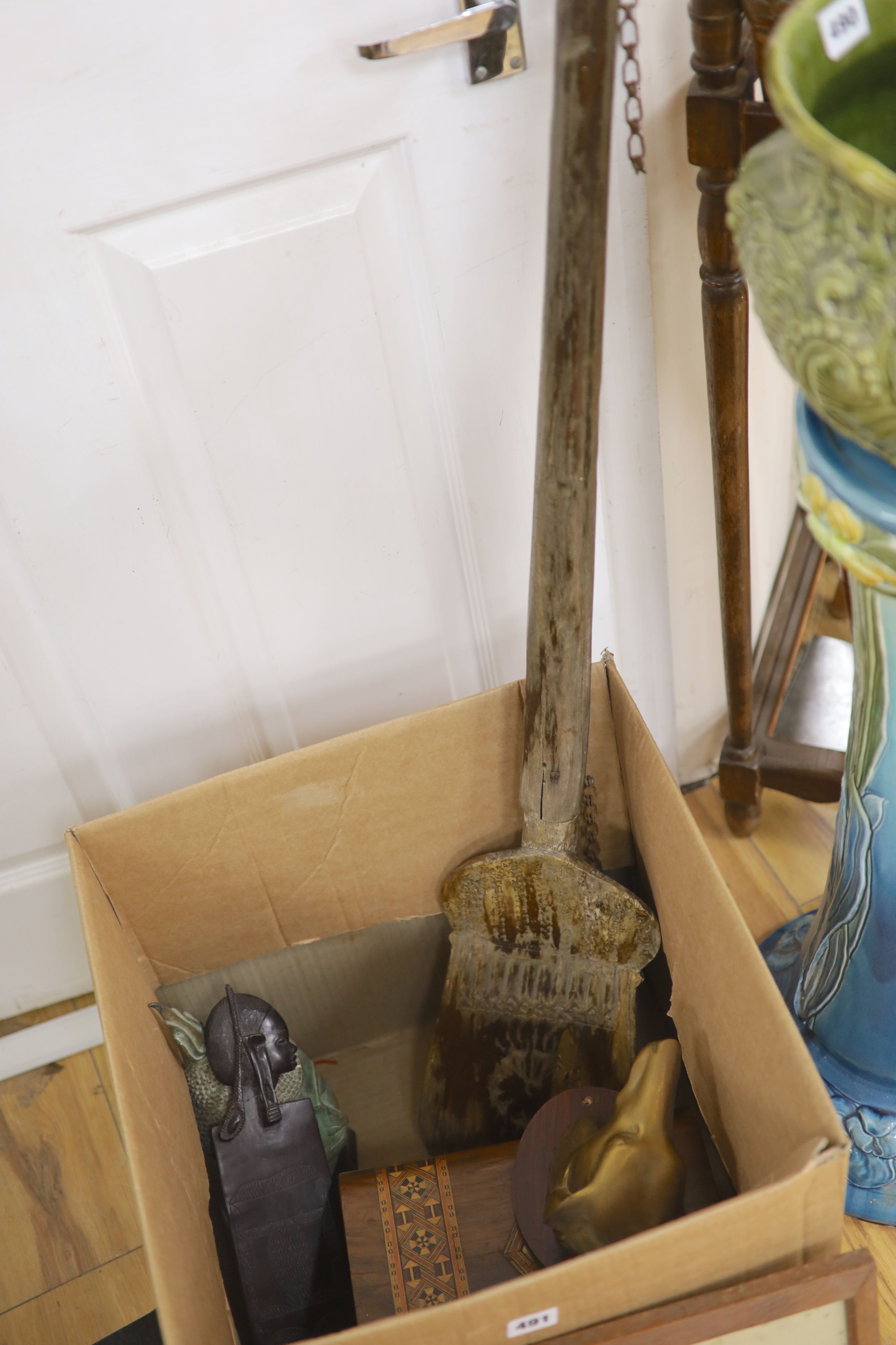 A quantity of mixed collectables including a grain shovel, a Buddha head, an African carved wood comb etc.